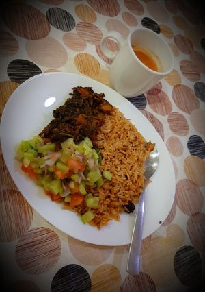 A picture of Palak chicken with brown rice.