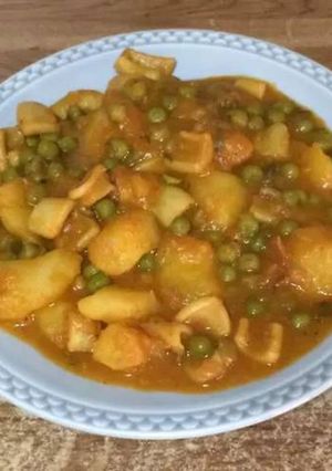 A picture of Stewed Squid with Potatoes and Peas.