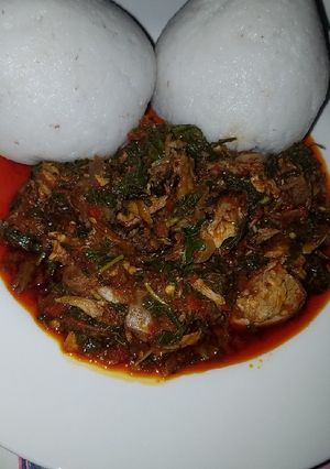 A picture of Tuwo with spinach soup.