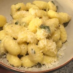 A picture of Pumpkin gnocchi with truffle oil and sage.