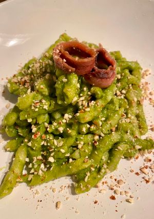 A picture of Busiate with Zucchini-Basil Pesto, Anchovies, and Chopped Almonds.