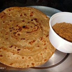 Lachcha paratha with wheat flour and til lahsun chutney A picture of Lachcha paratha with wheat flour and til lahsun chutney.