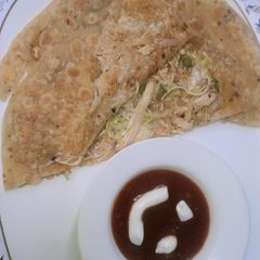 A picture of Cheesy chicken paratha 😋😋😋.