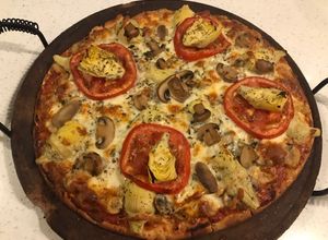 Una foto de Pizza vegetariana