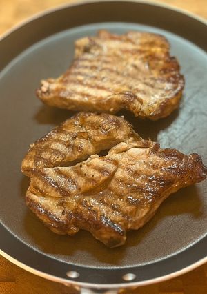 A picture of Port & Blackcurrant marinated Pork shoulder steaks.