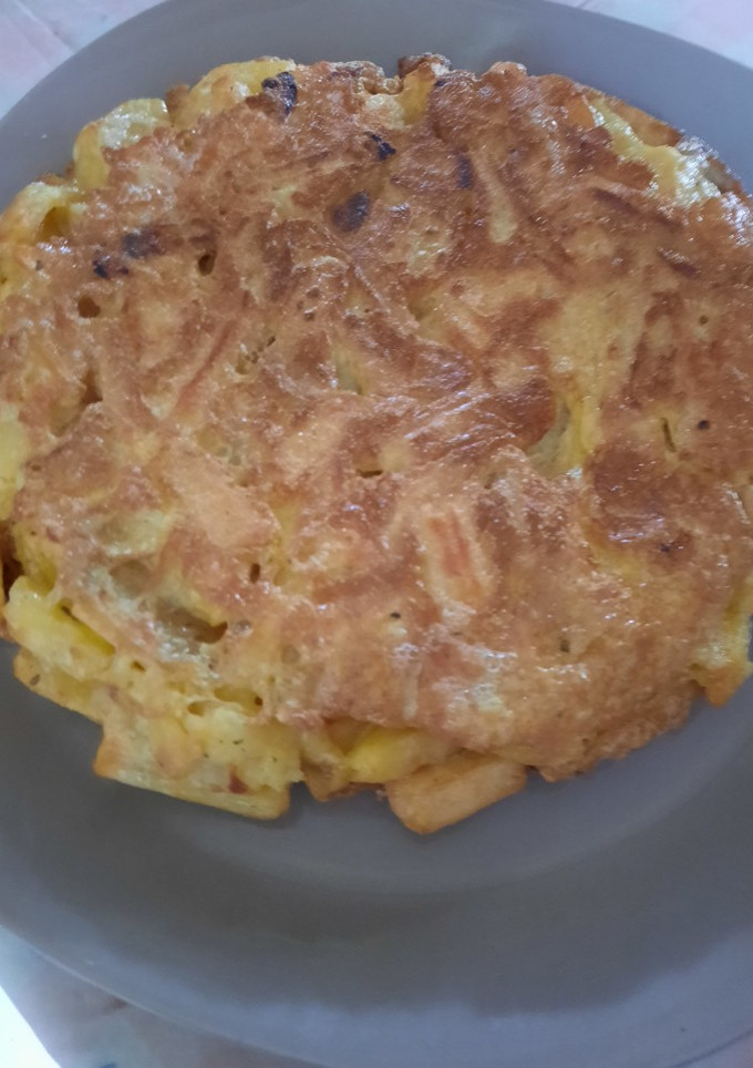 Una foto de Tortilla de papas con bastante cebolla 🤤