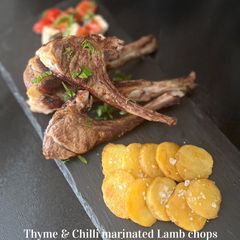 A picture of Lamb cutlets with thyme, chilli & Greek htipiti.