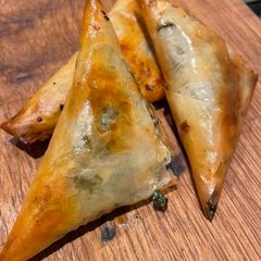 A picture of Spinach and feta filo parcels.