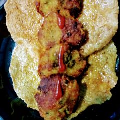 A picture of Methi palak kababs with aloo papad.