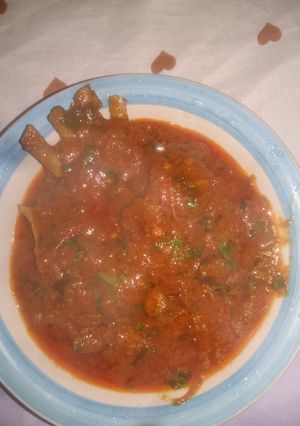 A picture of Fresh tomatoes and goat meat.