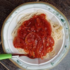 A picture of Spaghetti with sauce.