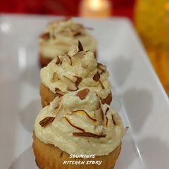 A picture of Kesar Baadam Cupcakes with Shrikhand Frosting.