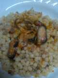 Fregola sarda con cozze vongole salmone e bottarga