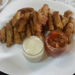 A picture of Wedges with  garlic mayo and salsa.