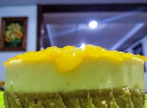 Una foto de Cheesecake c/ compota de mango y durazno