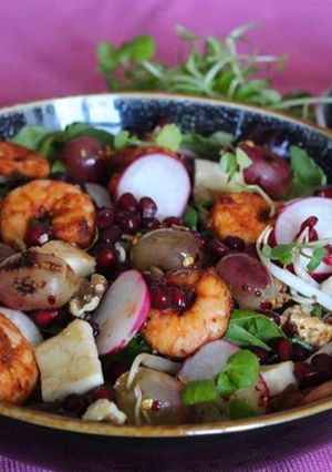 A picture of Roasted grapes with prawns and halumi salad.