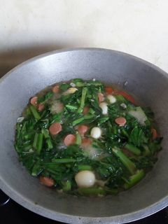 Foto resep Tumis Sawi Hijau Telur Puyuh + Sosis