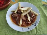 Una foto de carne paleta de cerdo guisada
