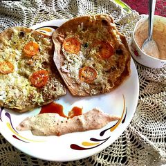 A picture of Egg Cheese Paratha with curd.