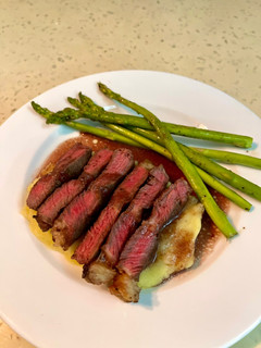 A picture of Steak with Mashed Potatoes and Red Wine Sauce.