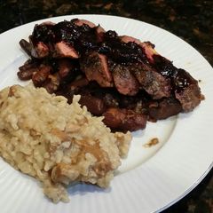 A picture of Brad's seared duck breast w/ blueberry balsamic reduction.