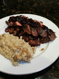 A picture of Brad's seared duck breast w/ blueberry balsamic reduction.