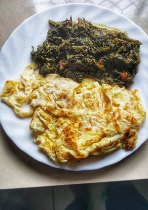 A picture of Managu with fried egg.