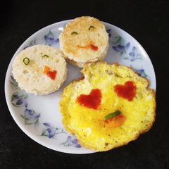 A picture of Emoji Omelette with bread toast.