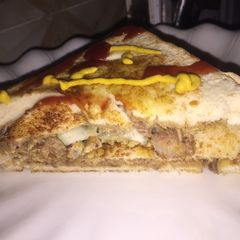 A picture of Fish and egg yolk sandwich.