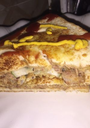 A picture of Fish and egg yolk sandwich.