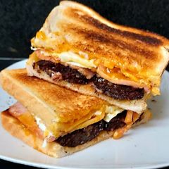 My Smokey Bacon, Black Pudding & fried Egg Toasted Sandwich 🥰 A picture of My Smokey Bacon, Black Pudding & fried Egg Toasted Sandwich 🥰.