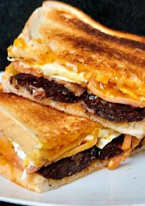 A picture of My Smokey Bacon, Black Pudding & fried Egg Toasted Sandwich 🥰.