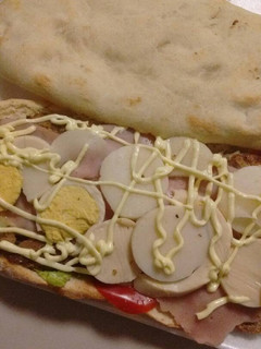 Una foto de "Completo de Mila con pan de pizza a la Pela Man"