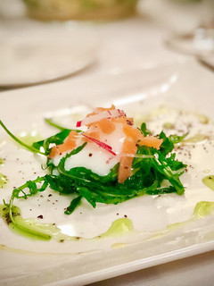 A picture of 65ºC / 149ºF slow cooked egg with salmon rocket salad.