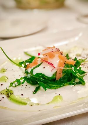A picture of 65ºC / 149ºF slow cooked egg with salmon rocket salad.