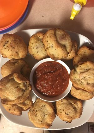 A picture of Pepperoni and sausage cheese bombs.