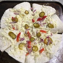 A picture of Tortilla cone pizza.