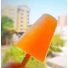 A picture of Orange Popsicle/ Ice cream.