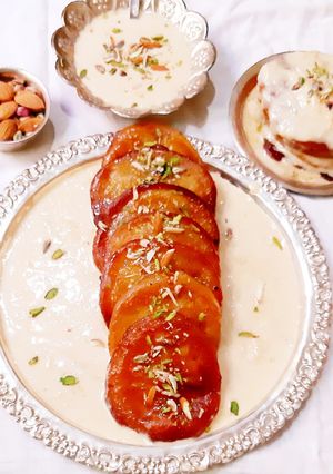A picture of Mango malpua with rabri.