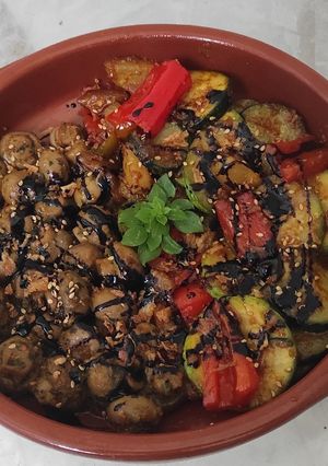 A picture of Mushrooms and Vegetables with a Mix of Sauces and Spices.