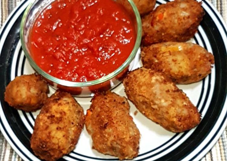 Potato nuggets served with marinara sauce