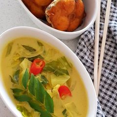 A picture of Of Cabbage Sodhi and Fried Fish.