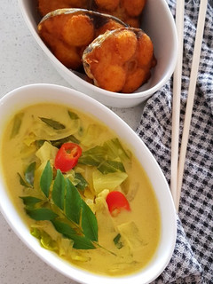 A picture of Of Cabbage Sodhi and Fried Fish.