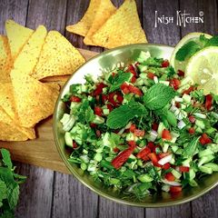 A picture of Cucumber Salsa with Tortilla Chips.