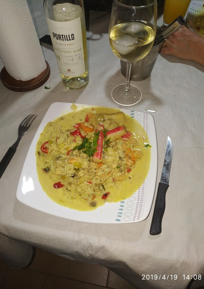 Una foto de Mariscos a la crema parmesana al disco