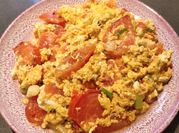 A picture of tomato with egg