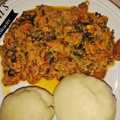 A picture of Semo with Egusi soup.
