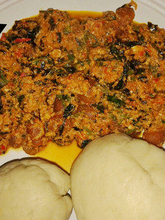A picture of Semo with Egusi soup.
