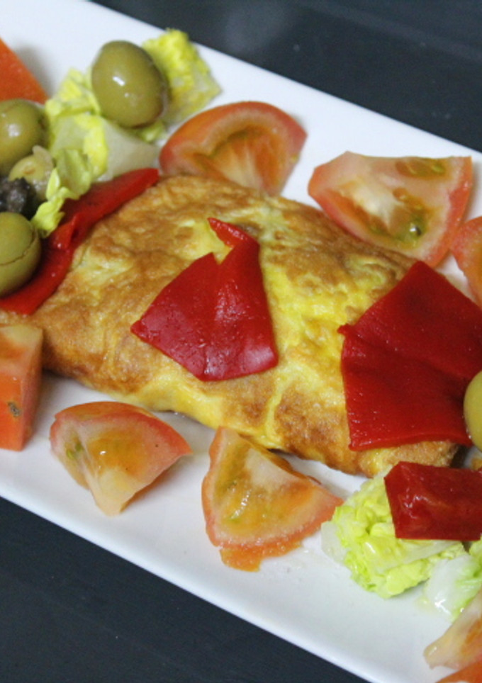 Una foto de Tortilla cuadrada enrollada con queso y pimiento