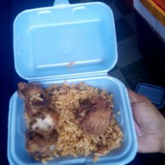 A picture of Nigerian Jollof rice and Fried Turkey.
